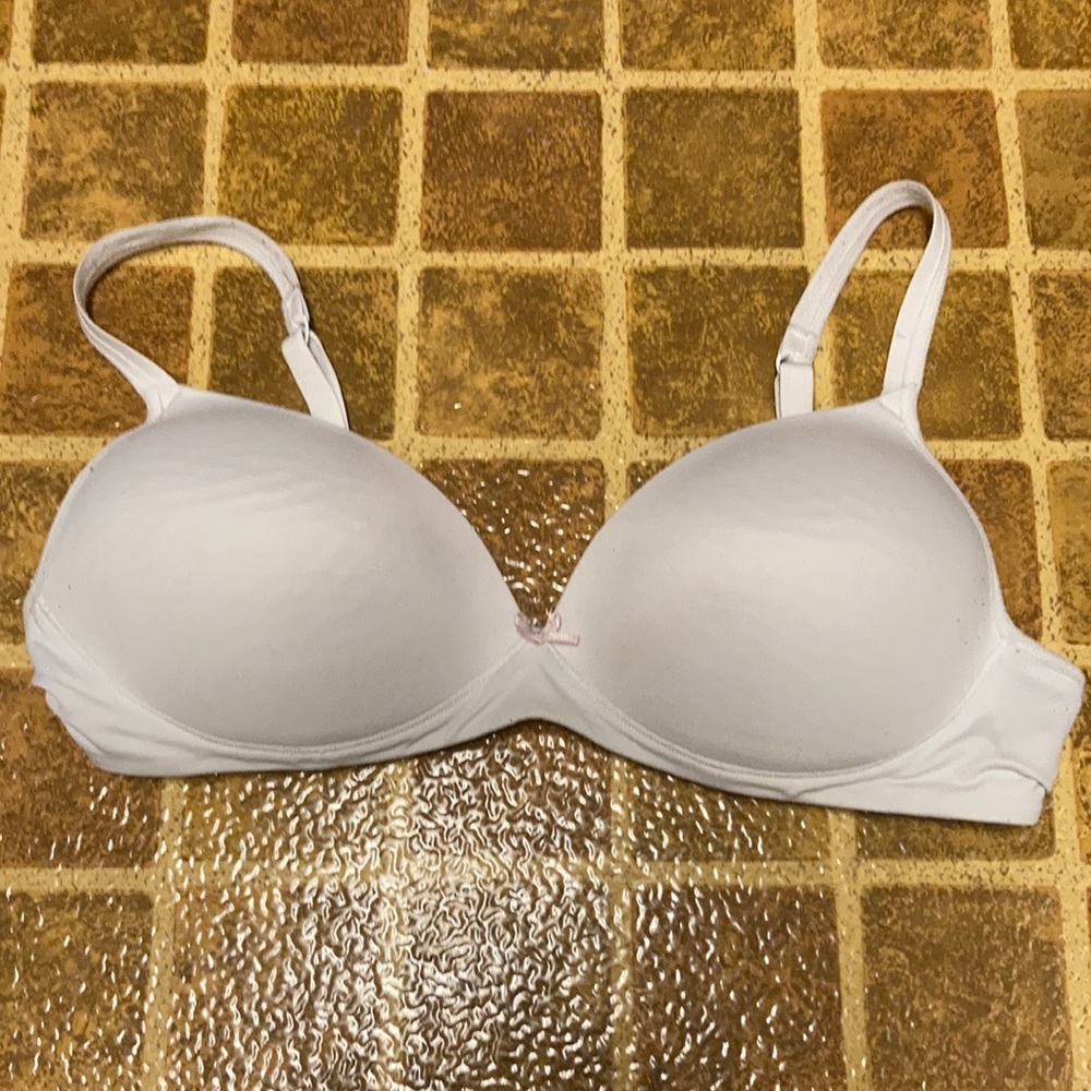 Bra, white with pink bow, the brand is not known, size is 36B.
